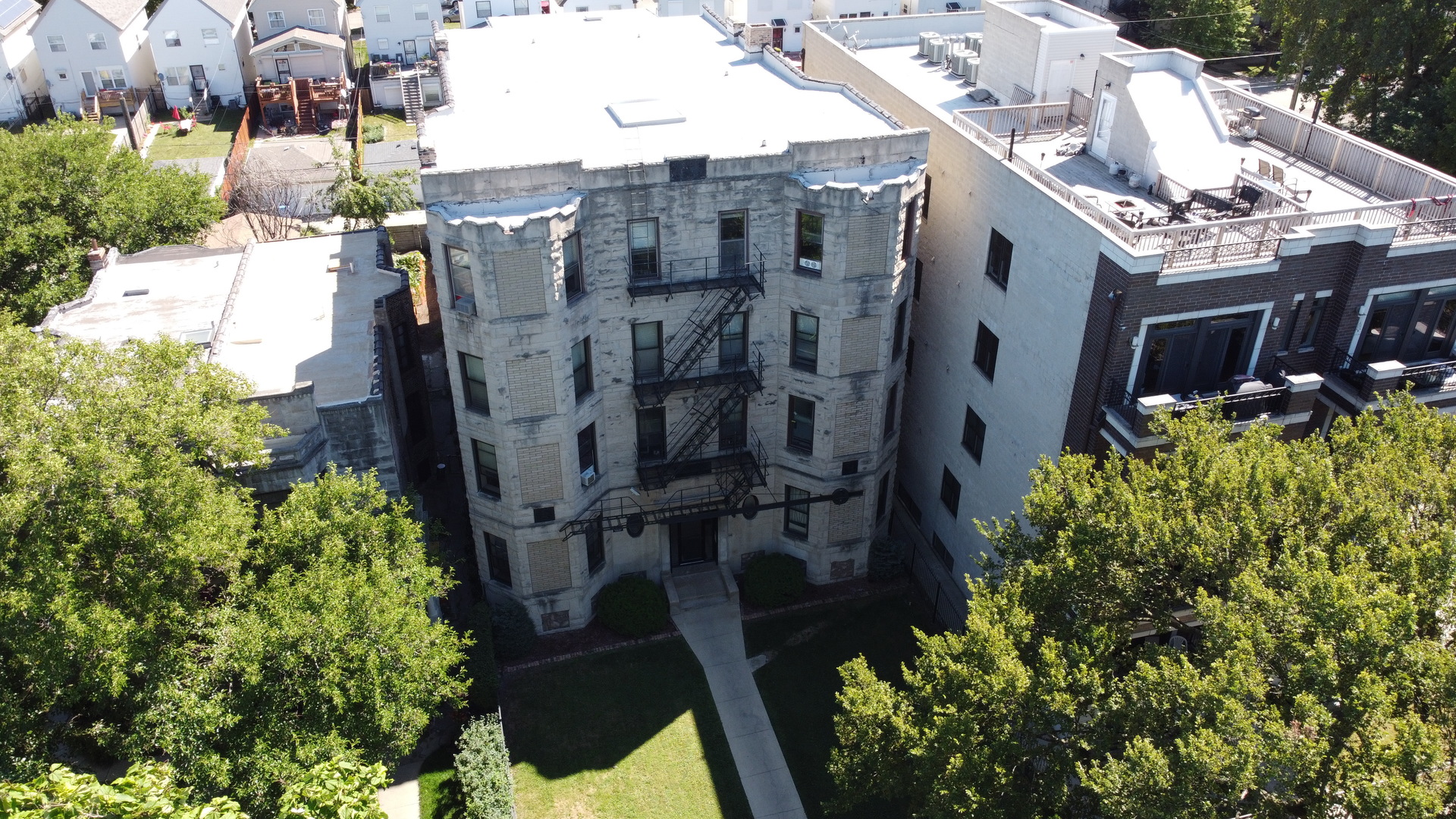 6527 South Kimbark Avenue, Unit 1F Chicago, IL 60637 - Photo 16 of 18 a aerial view of multi story residential apartment building