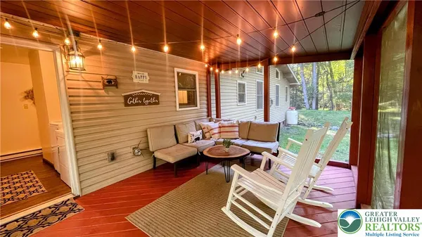 a view of a backyard with sitting area