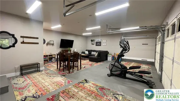 a view of a dining room and hall with furniture