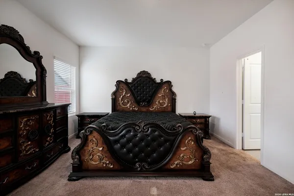 a bedroom with a bed and a fireplace