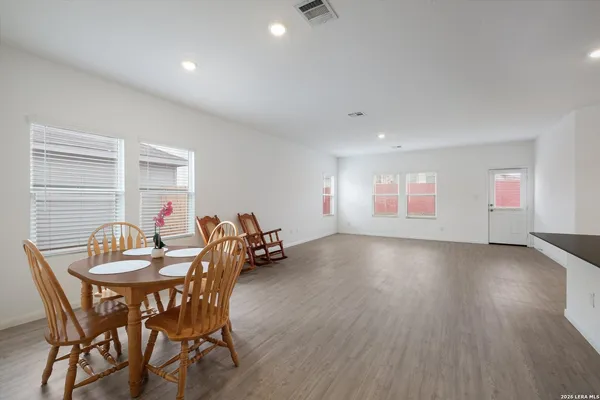 a dining room with furniture and window