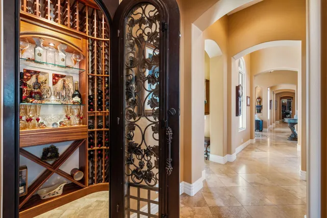 a living room with patio furniture and a potted plants