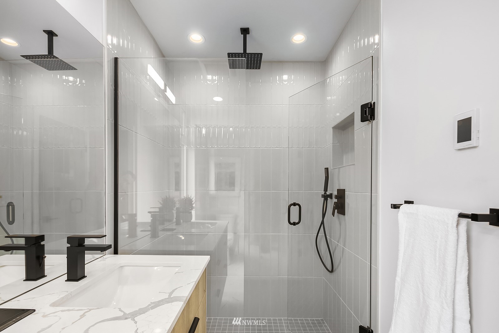 604 North 43rd Street Seattle, WA 98103 - Photo 18 of 26 a bathroom with a tub shower and sink