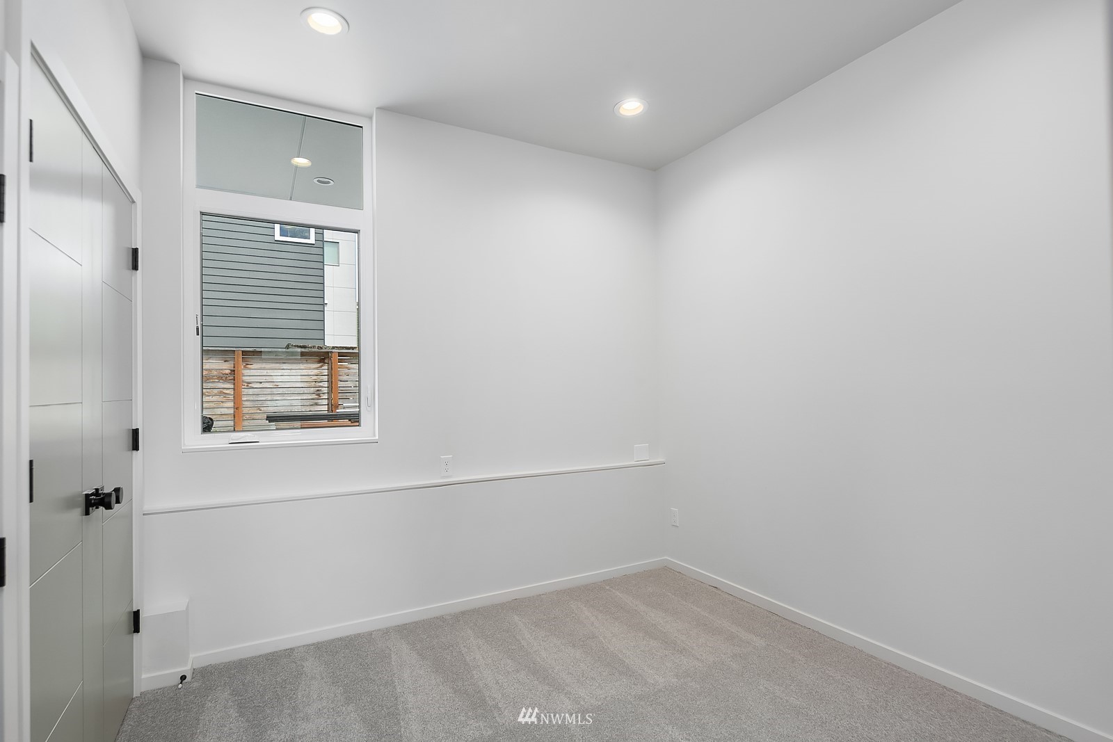 604 North 43rd Street Seattle, WA 98103 - Photo 19 of 26 an empty room with windows