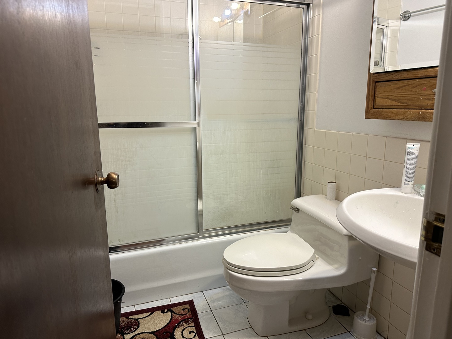 3609 Central Road, Unit 302 Glenview, IL 60025 - Photo 12 of 15 a white toilet sitting next to a bathroom sink