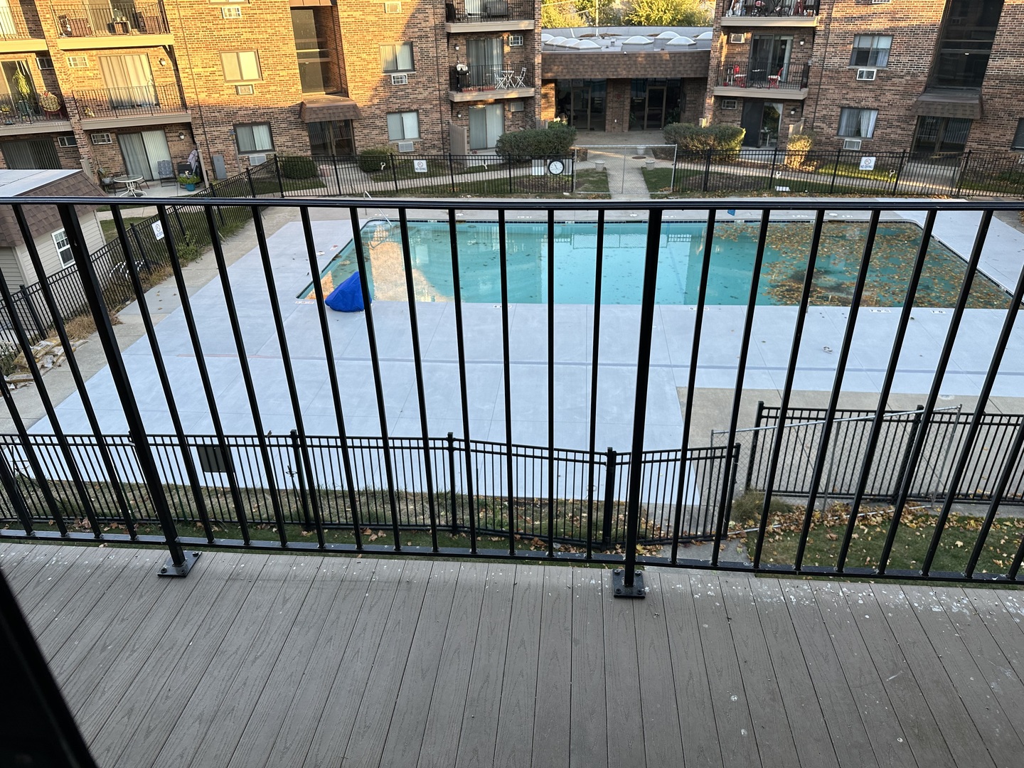 3609 Central Road, Unit 302 Glenview, IL 60025 - Photo 14 of 15 a view of a balcony with floor to ceiling window and wooden floor