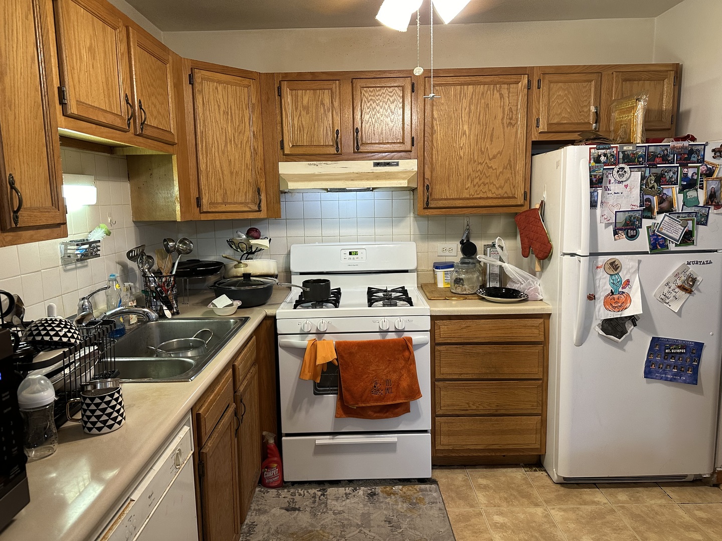 3609 Central Road, Unit 302 Glenview, IL 60025 - Photo 4 of 15 a kitchen with kitchen island a sink stove and cabinets