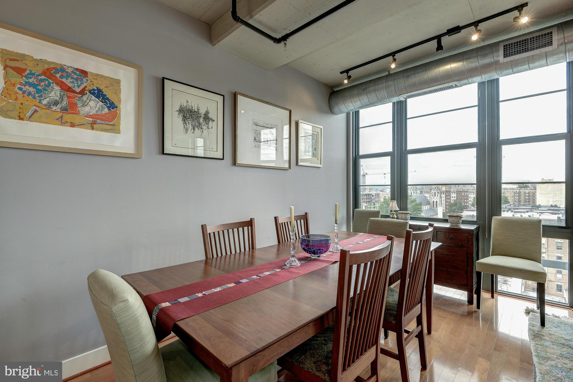 2125 14th Street Northwest, Unit 913 Washington, DC 20009 - Photo 4 of 14 a view of a dining room with furniture large window and outside view