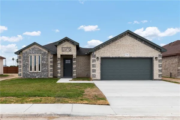 an empty room with a ceiling fan and carpet