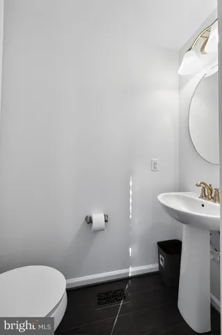 a bathroom with a sink toilet and vanity