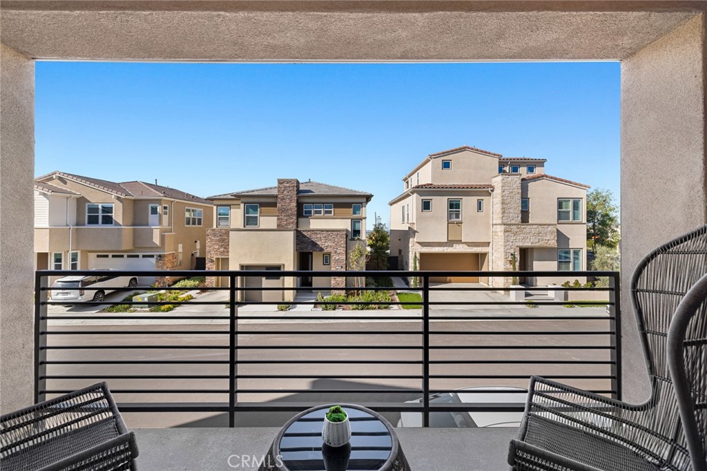 526 Serrano Summit Drive Lake Forest, CA 92630 - Photo 12 of 59 a view of a balcony with a couple of cars parked in front of it