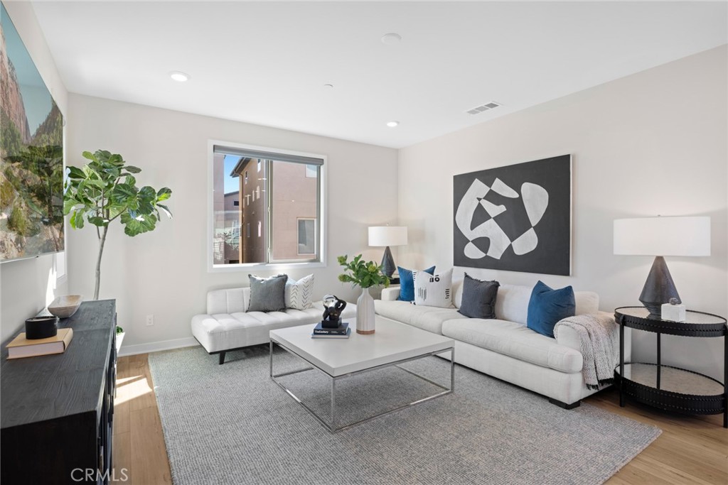 526 Serrano Summit Drive Lake Forest, CA 92630 - Photo 14 of 59 a living room with furniture and a potted plant