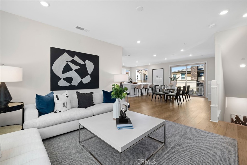 526 Serrano Summit Drive Lake Forest, CA 92630 - Photo 17 of 59 a living room with furniture and wooden floor