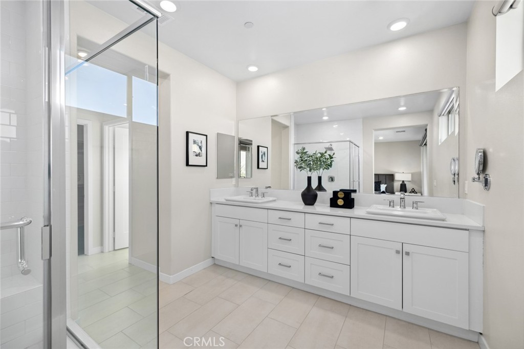 526 Serrano Summit Drive Lake Forest, CA 92630 - Photo 23 of 59 a bathroom with a double vanity sink and a mirror