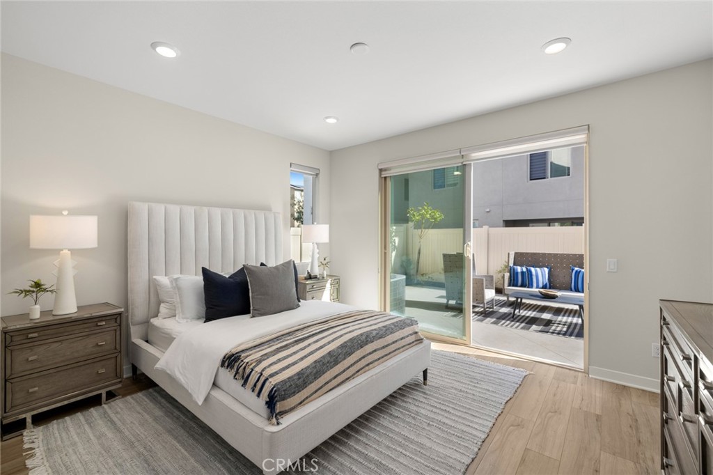 526 Serrano Summit Drive Lake Forest, CA 92630 - Photo 29 of 59 a bedroom with a bed and wooden floor