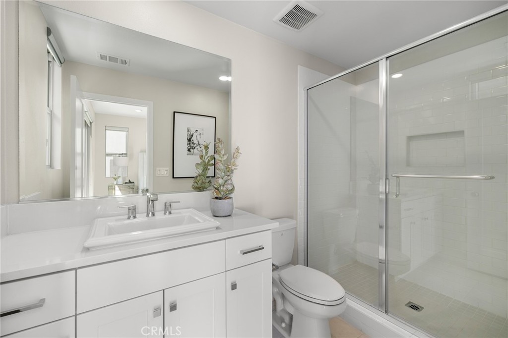 526 Serrano Summit Drive Lake Forest, CA 92630 - Photo 33 of 59 a bathroom with a shower sink vanity mirror and toilet