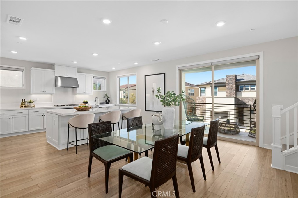 526 Serrano Summit Drive Lake Forest, CA 92630 - Photo 4 of 59 a view of a dining room with furniture and wooden floor