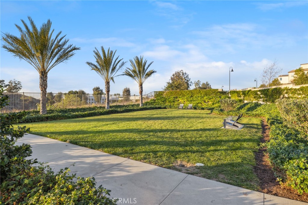 526 Serrano Summit Drive Lake Forest, CA 92630 - Photo 58 of 59 a view of a swimming pool with a table and chairs