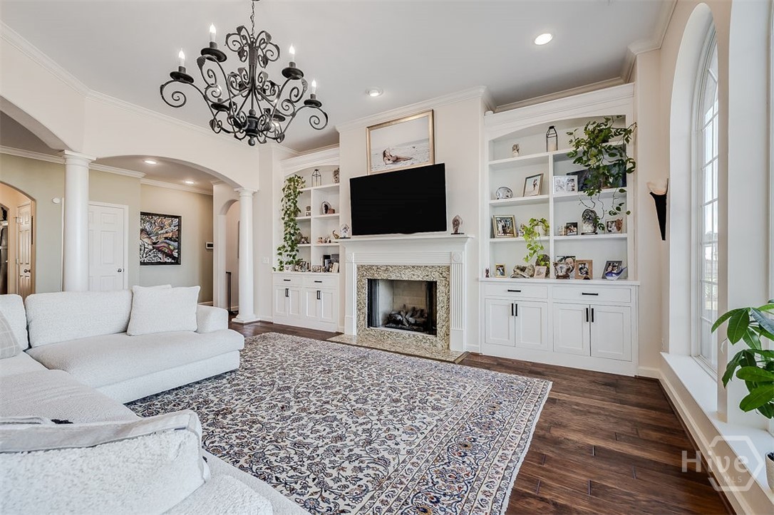 663 Wyndham Way Pooler, GA 31322 - Photo 16 of 66 Living room with fireplace and custom built in bookshelves
