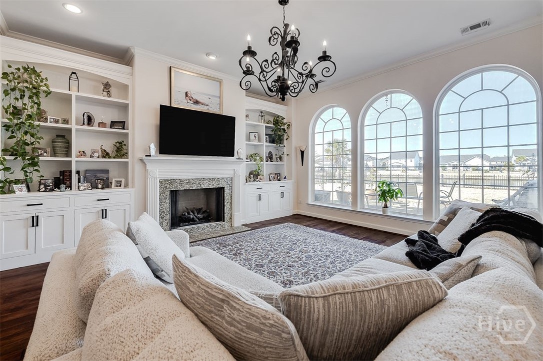 663 Wyndham Way Pooler, GA 31322 - Photo 17 of 66 Gorgeous floor to ceiling windows in the living room soaking the home with natural light