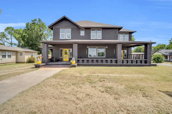 front view of a house with a yard