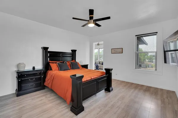 a bed room with a bed and a window