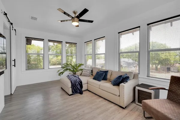 a living room with furniture and a large window