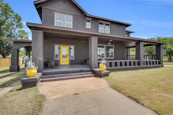 a view of a house with outdoor seating space