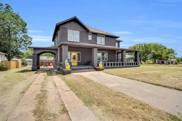 front view of a house with a yard