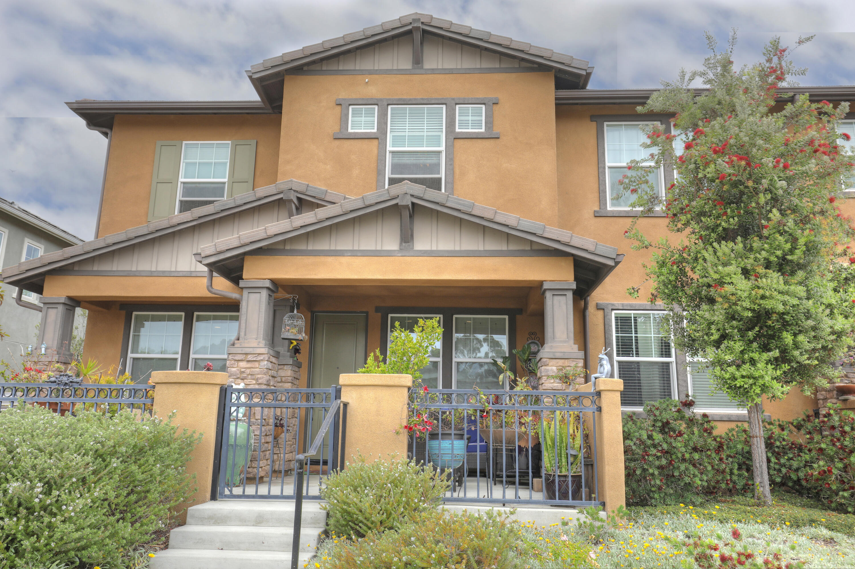 a front view of a house with garden