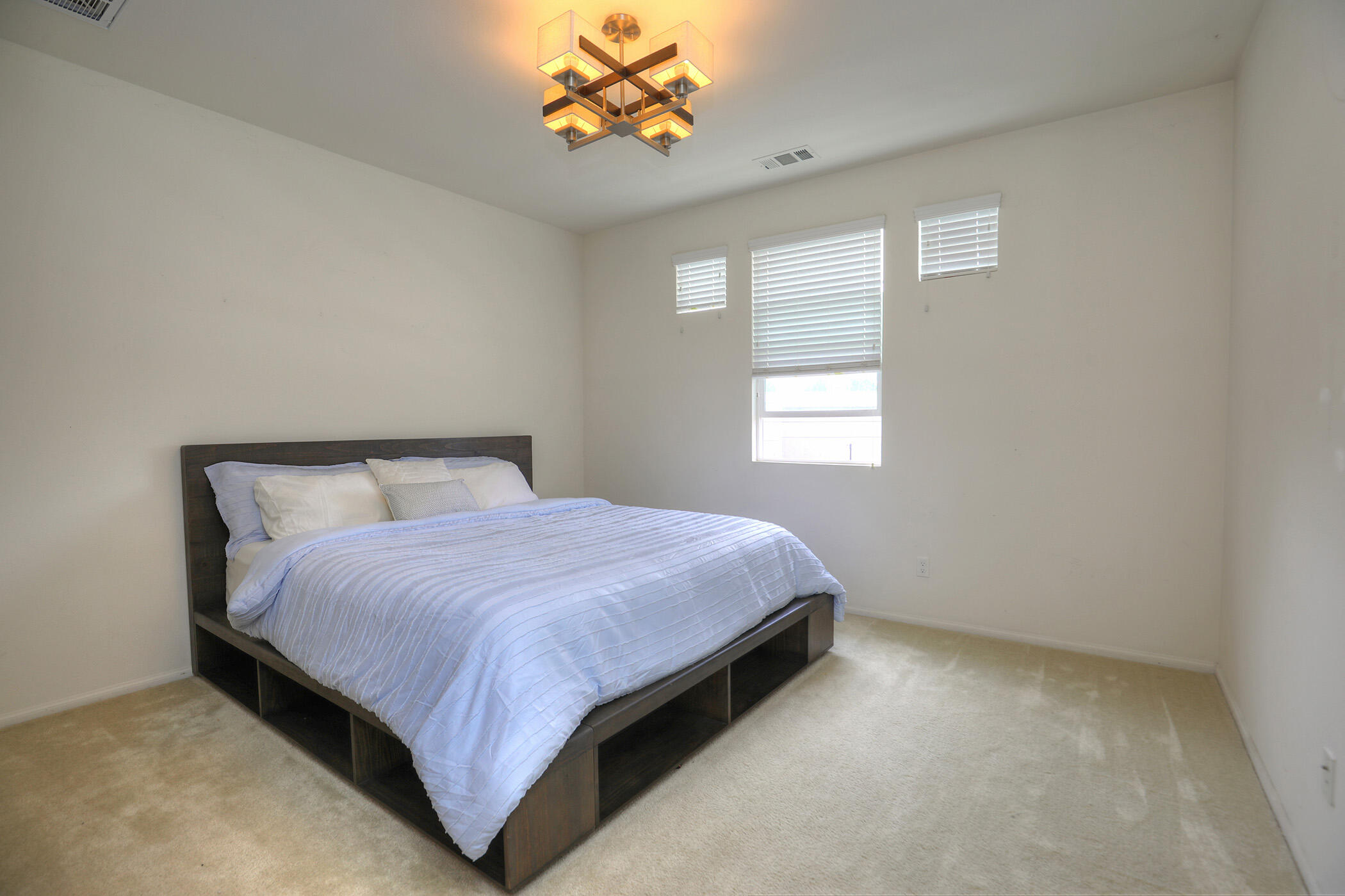 6607 Fathom Way Goleta, CA 93117 - Photo 18 of 37 a bed sitting in a bedroom next to a window