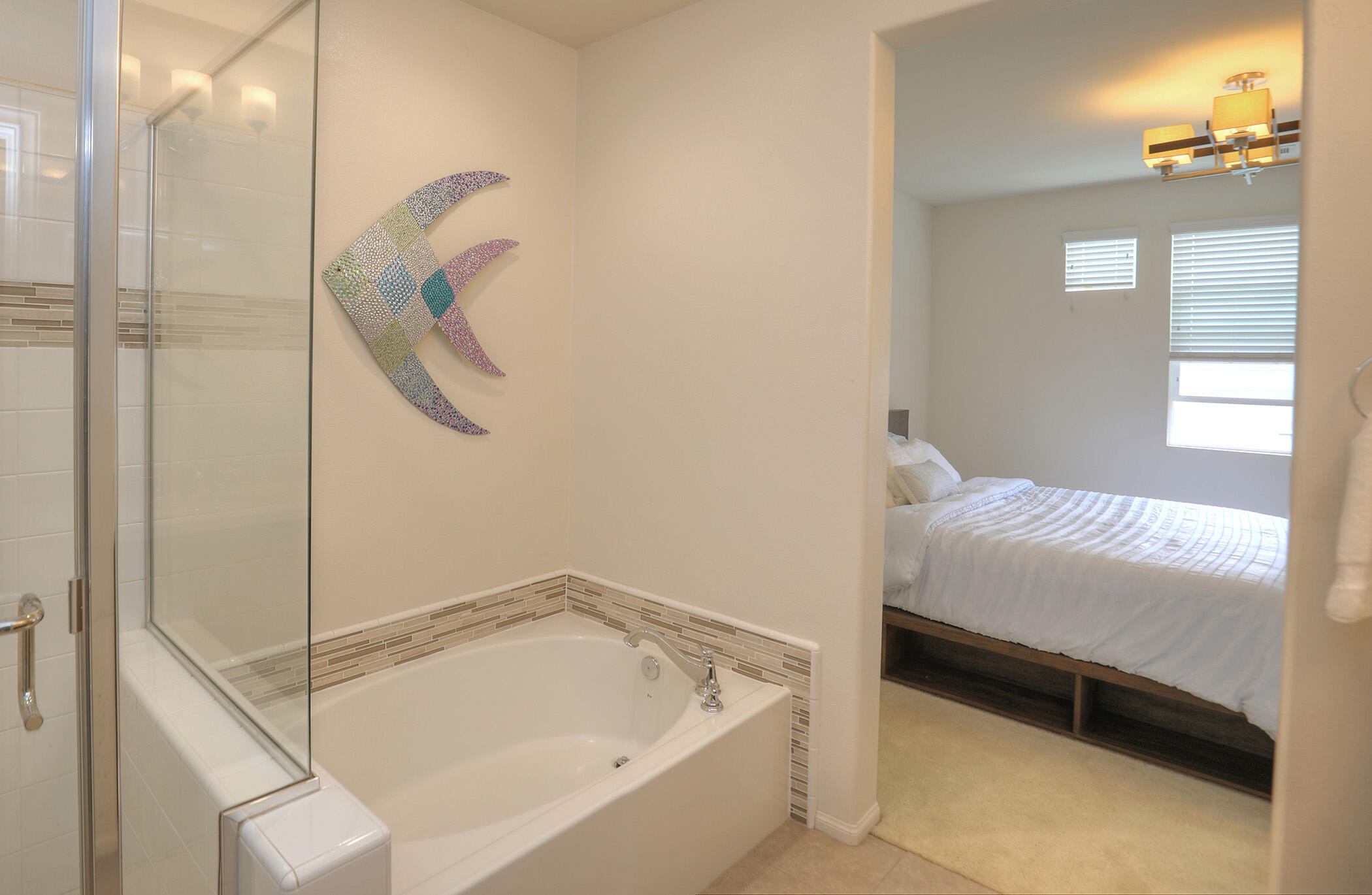 6607 Fathom Way Goleta, CA 93117 - Photo 21 of 37 a bathroom with a tub and shower
