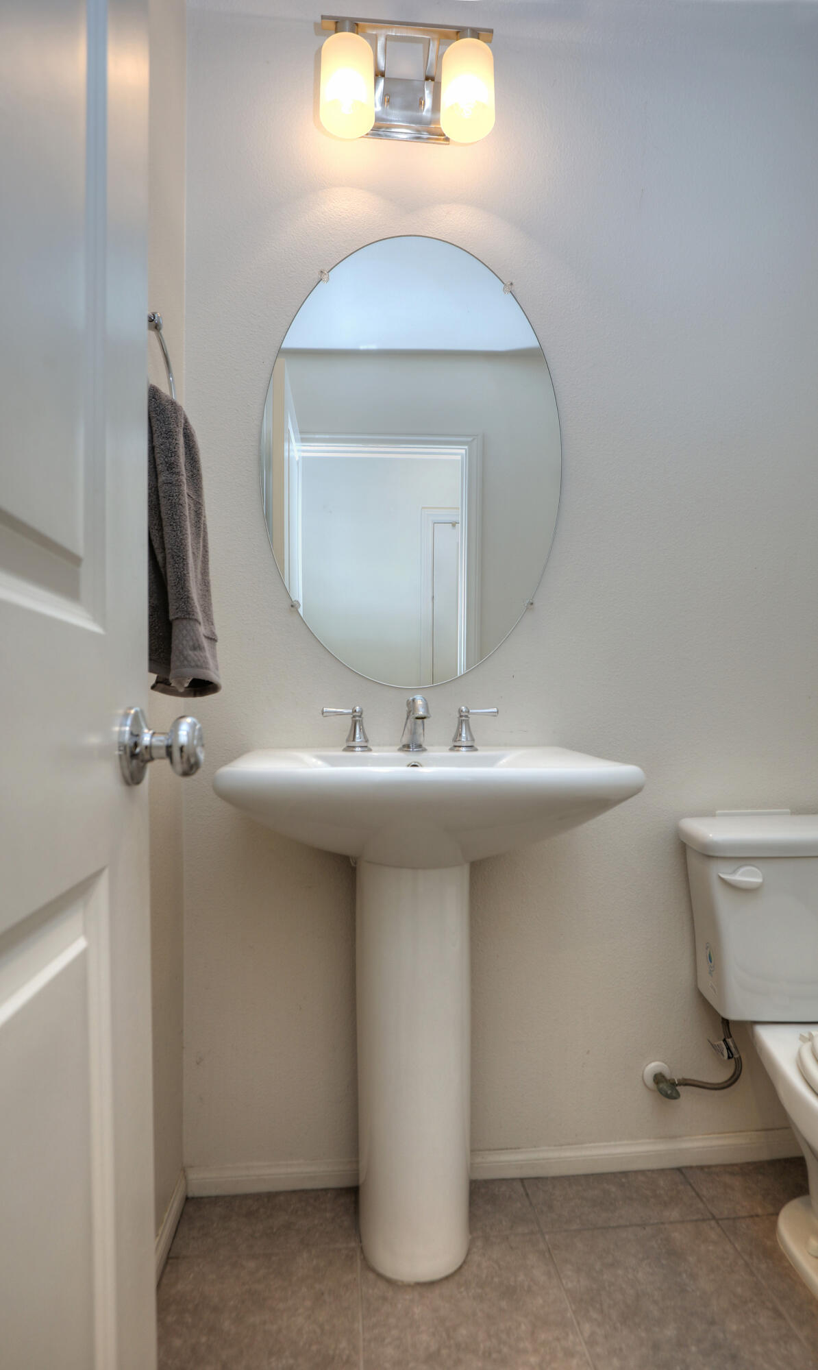 6607 Fathom Way Goleta, CA 93117 - Photo 24 of 37 a bathroom with a sink a toilet and mirror