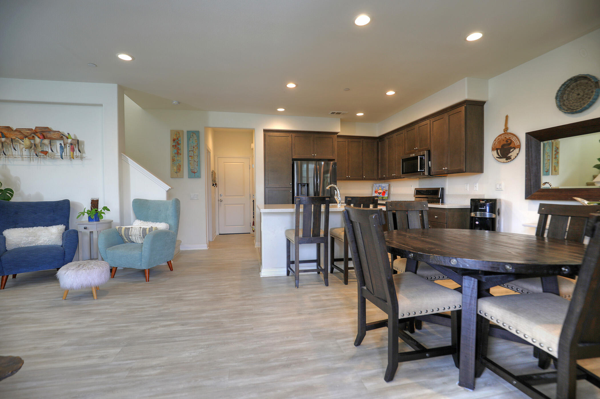 6607 Fathom Way Goleta, CA 93117 - Photo 5 of 37 a view of a dining room with furniture and wooden floor