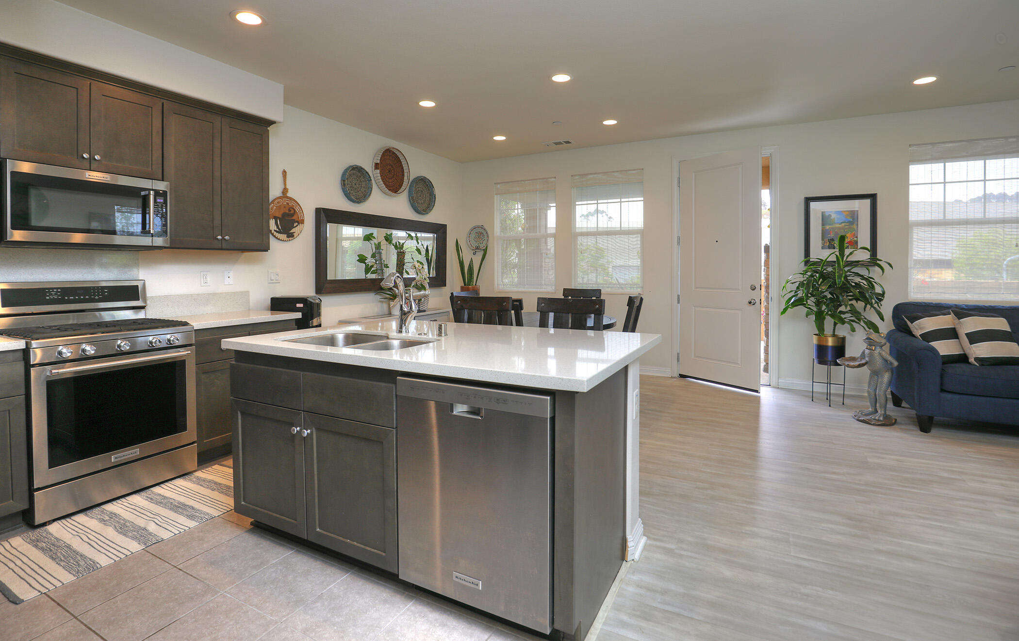 6607 Fathom Way Goleta, CA 93117 - Photo 10 of 37 a kitchen with stainless steel appliances granite countertop a sink stove and cabinets