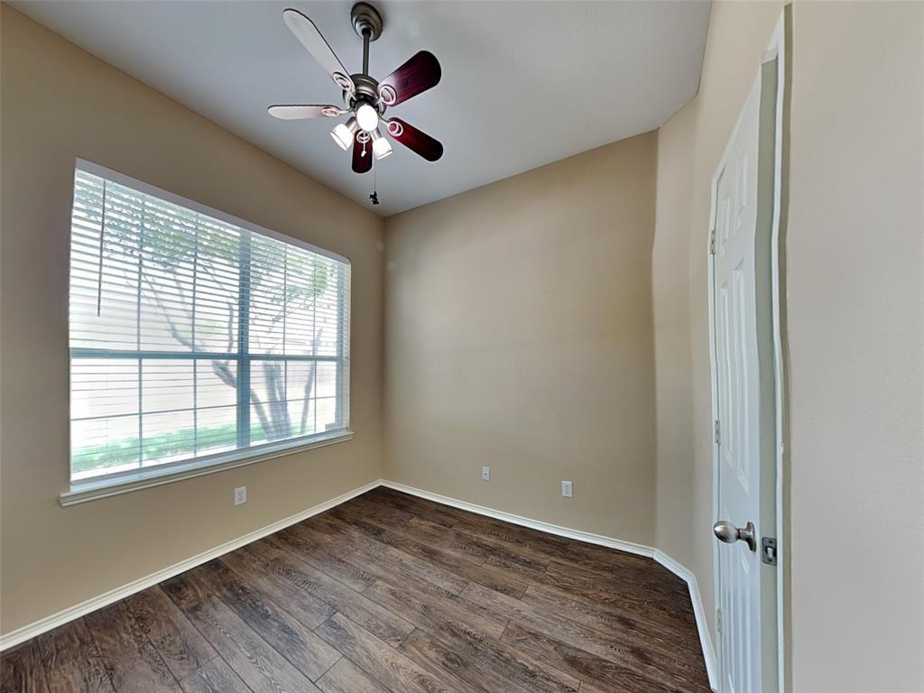 645 Chalk Knoll Road Fort Worth, TX 76108 - Photo 12 of 17 wooden floor in an empty room with a window