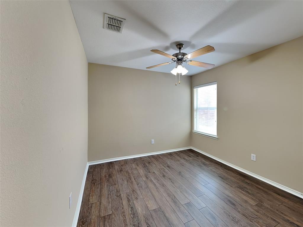 645 Chalk Knoll Road Fort Worth, TX 76108 - Photo 13 of 17 wooden floor in an empty room with a window