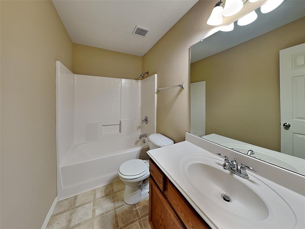 645 Chalk Knoll Road Fort Worth, TX 76108 - Photo 14 of 17 a bathroom with a sink toilet and shower