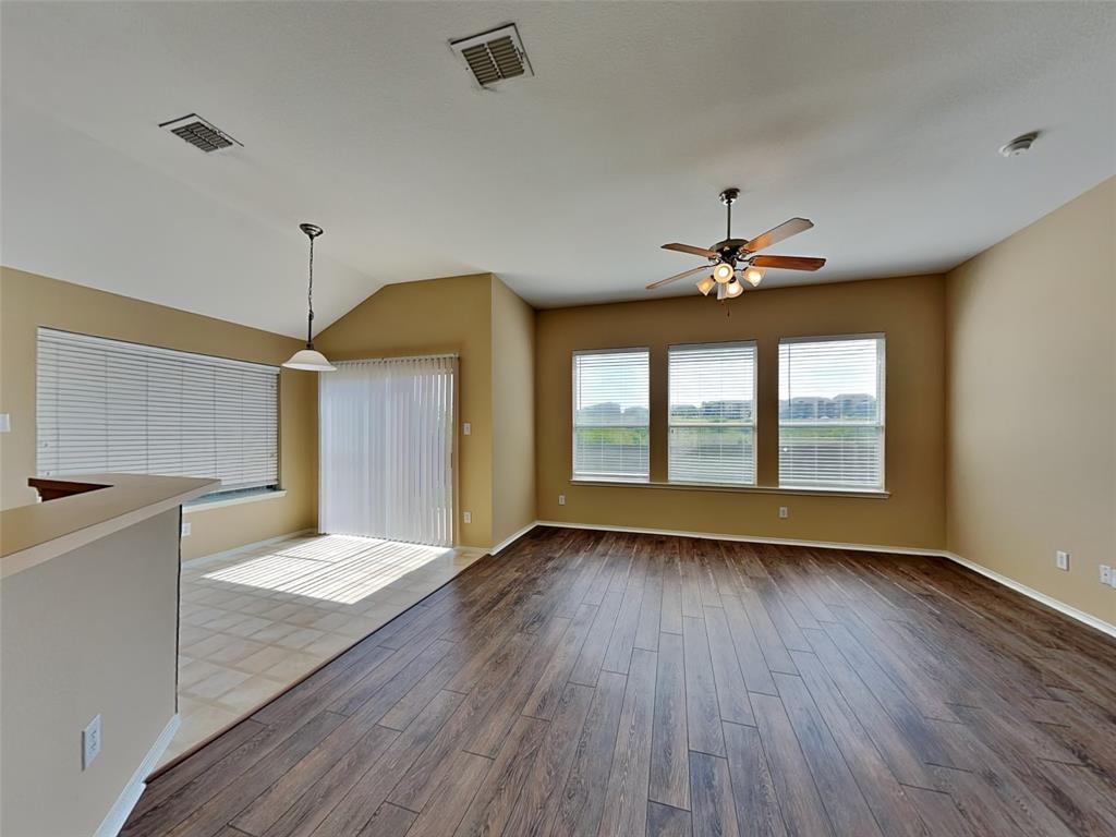 645 Chalk Knoll Road Fort Worth, TX 76108 - Photo 3 of 17 a view of an empty room with a window and wooden floor