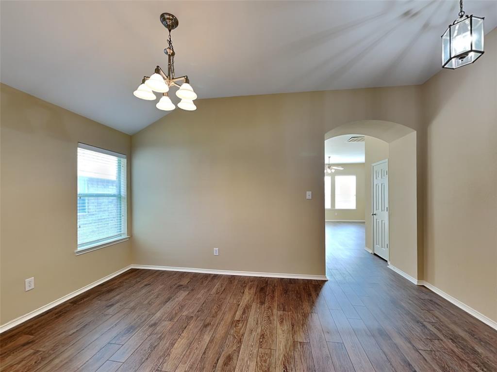 645 Chalk Knoll Road Fort Worth, TX 76108 - Photo 6 of 17 wooden floor in an empty room with a window