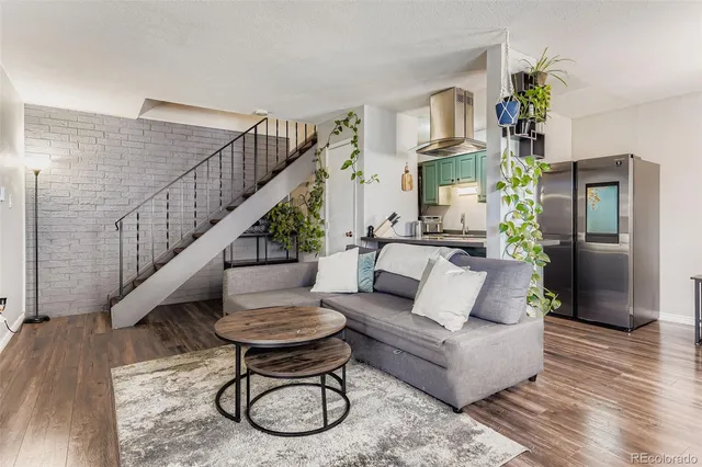 a living room with furniture and a table
