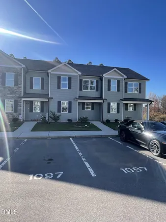a front view of a house with yard
