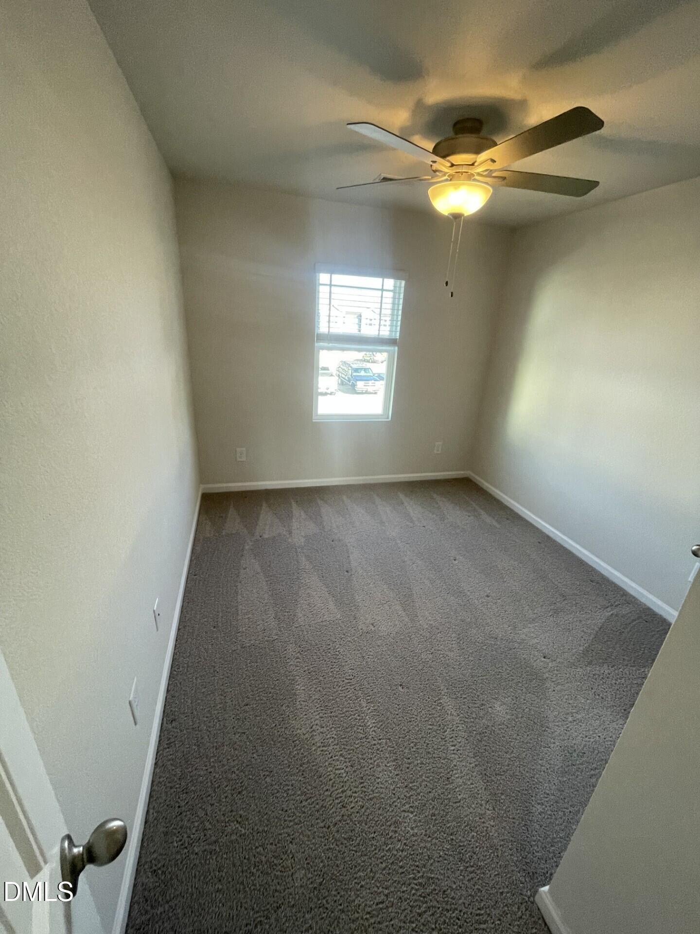 1097 Peony Lane Youngsville, NC 27596 - Photo 11 of 15 an empty room with a empty space and windows
