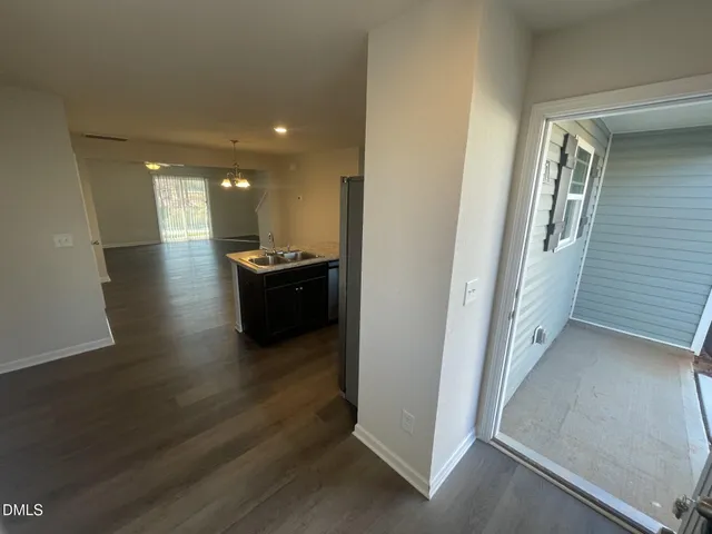 a kitchen with a refrigerator and a sink