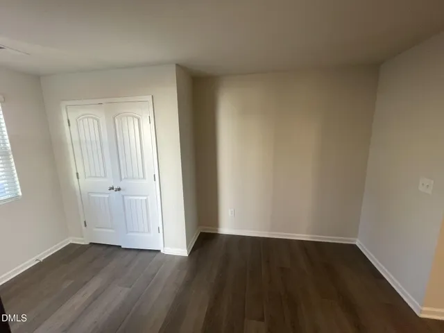 a kitchen with stainless steel appliances granite countertop a sink a stove a refrigerator a washer dryer and a cabinets