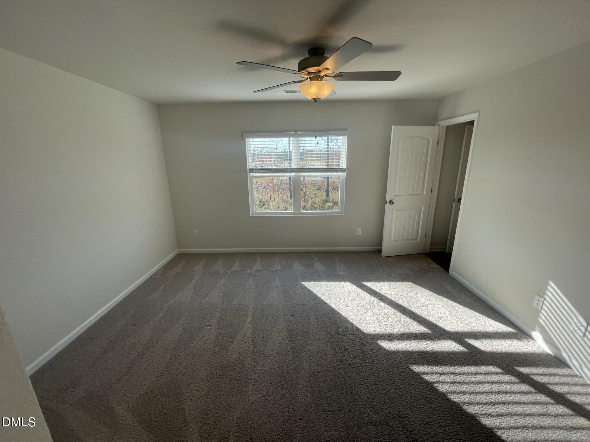 1097 Peony Lane Youngsville, NC 27596 - Photo 7 of 15 a view of an empty room with a window