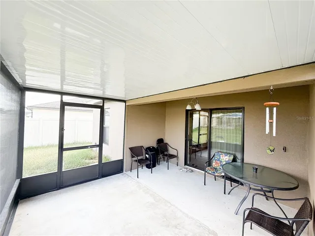 a view of a livingroom with furniture and windows
