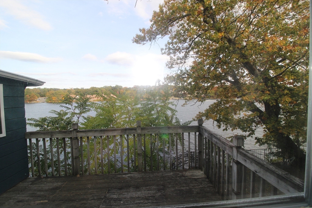 340 Lake Avenue Worcester, MA 01604 - Photo 14 of 37 a balcony with wooden floor and fence