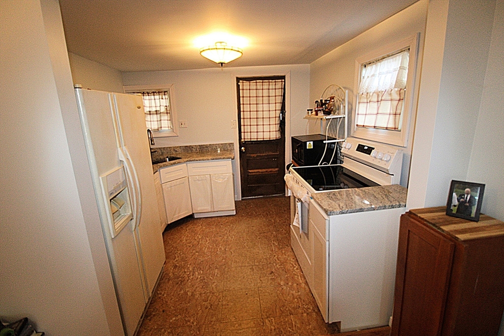 340 Lake Avenue Worcester, MA 01604 - Photo 17 of 37 a kitchen with a refrigerator stove and sink