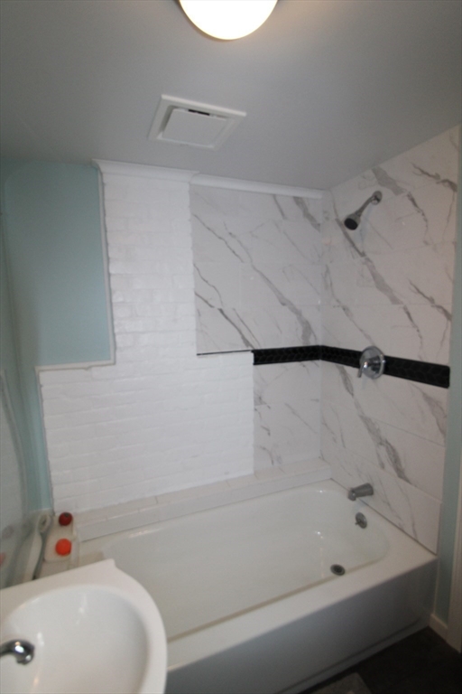 340 Lake Avenue Worcester, MA 01604 - Photo 29 of 37 a bathroom with a bathtub and a shower